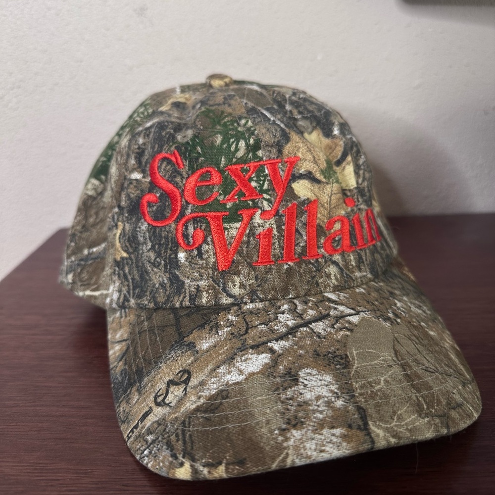 Remi Wolf Merch - Sexy Villain Embroidered Camo Baseball Cap